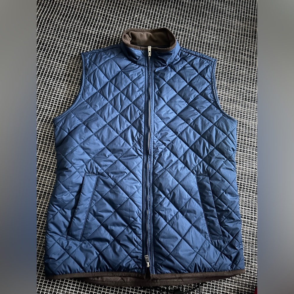 Peter Miller.  navy blue’s vest